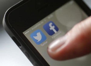 facebook and twitter on mobile reuters