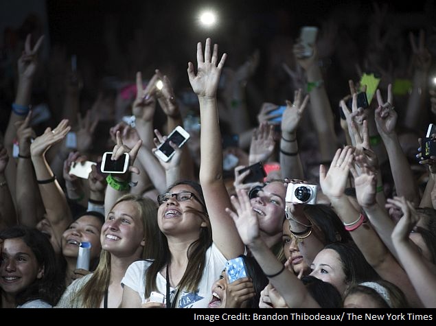 Girls in the crowd cheer before a performance at a DigiTour show in Dallas.