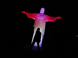 The statue of Christ the Redeemer is lit up in Canada's official colours, red and white, for Canada Day in Rio de Janeiro