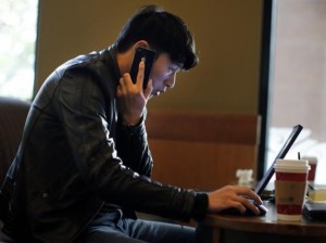man mobile laptop
