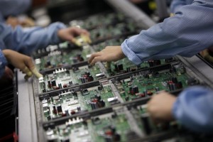 Celestica employees work at a production line in a factory in Dongguan, China's southern Guangdong province
