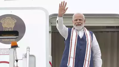PM Modi boarding off a plane